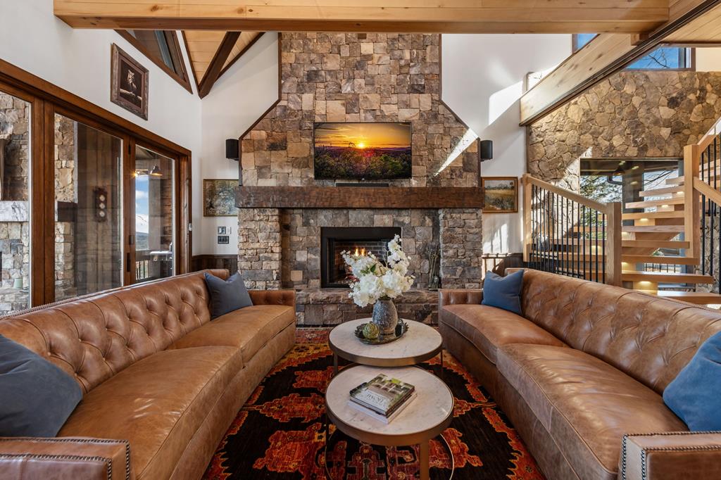 520 Overlook Drive Blue Ridge, GA 30513 - Photo 19 of 84 a living room with furniture a fireplace and a flat screen tv