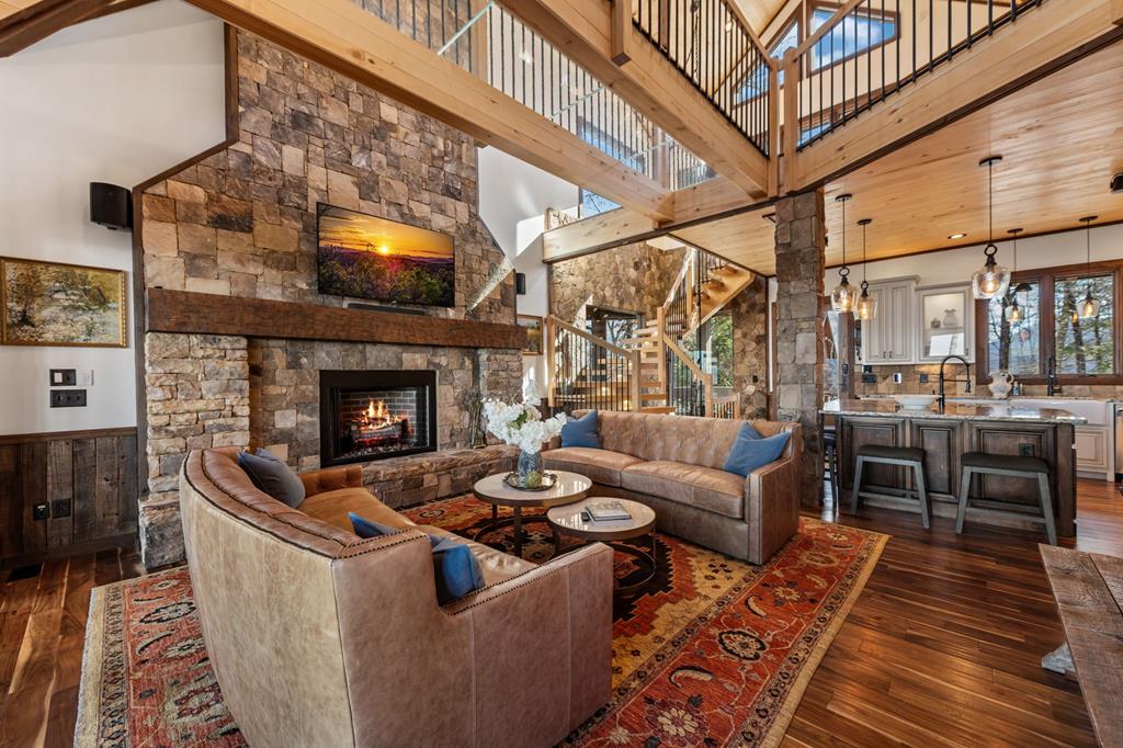 520 Overlook Drive Blue Ridge, GA 30513 - Photo 20 of 84 a living room with furniture a fireplace and a flat screen tv