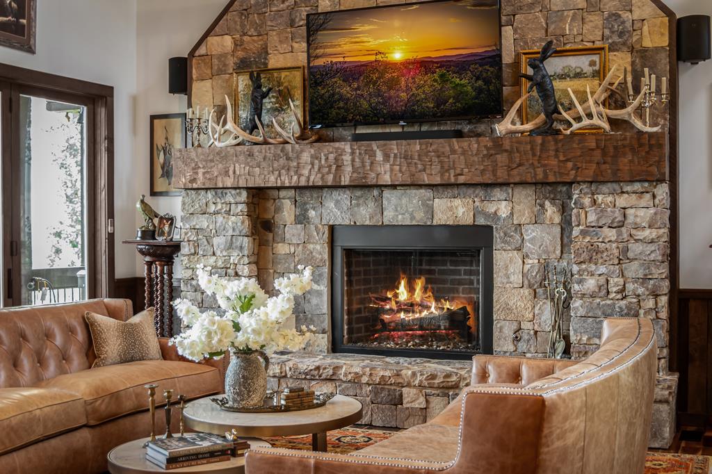520 Overlook Drive Blue Ridge, GA 30513 - Photo 21 of 84 a living room with furniture a flat screen tv and a fireplace