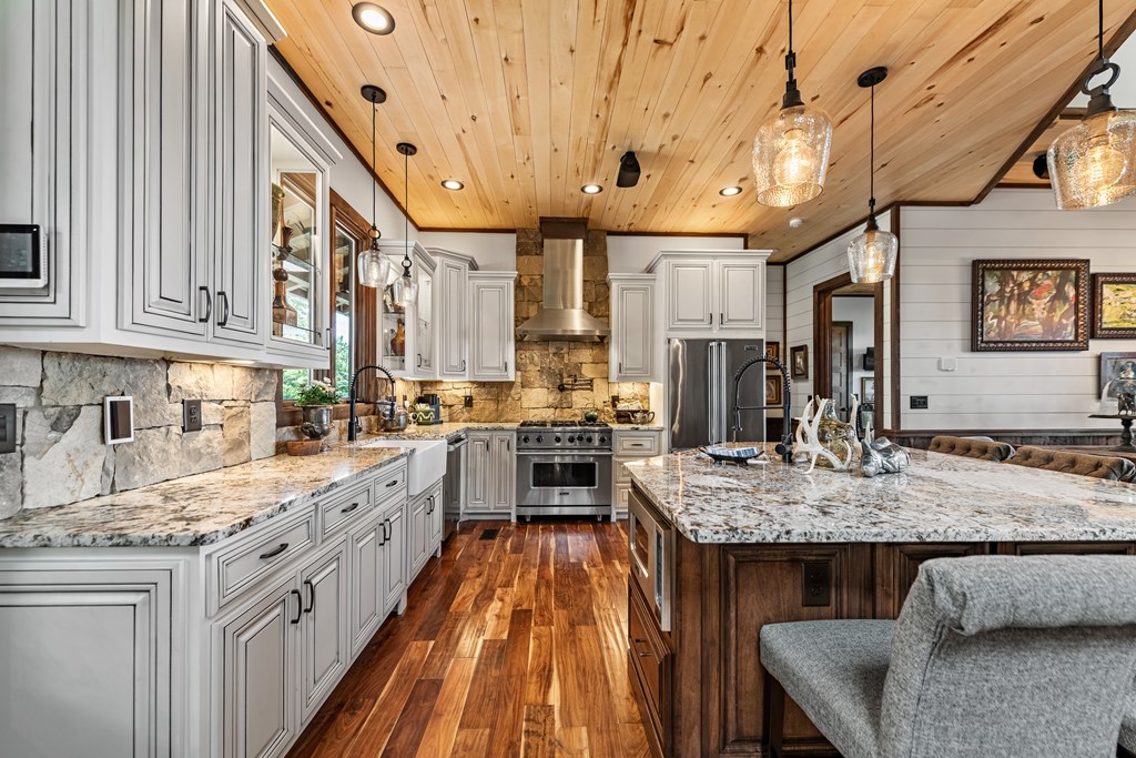 520 Overlook Drive Blue Ridge, GA 30513 - Photo 28 of 84 a kitchen with stainless steel appliances granite countertop a sink stove and refrigerator