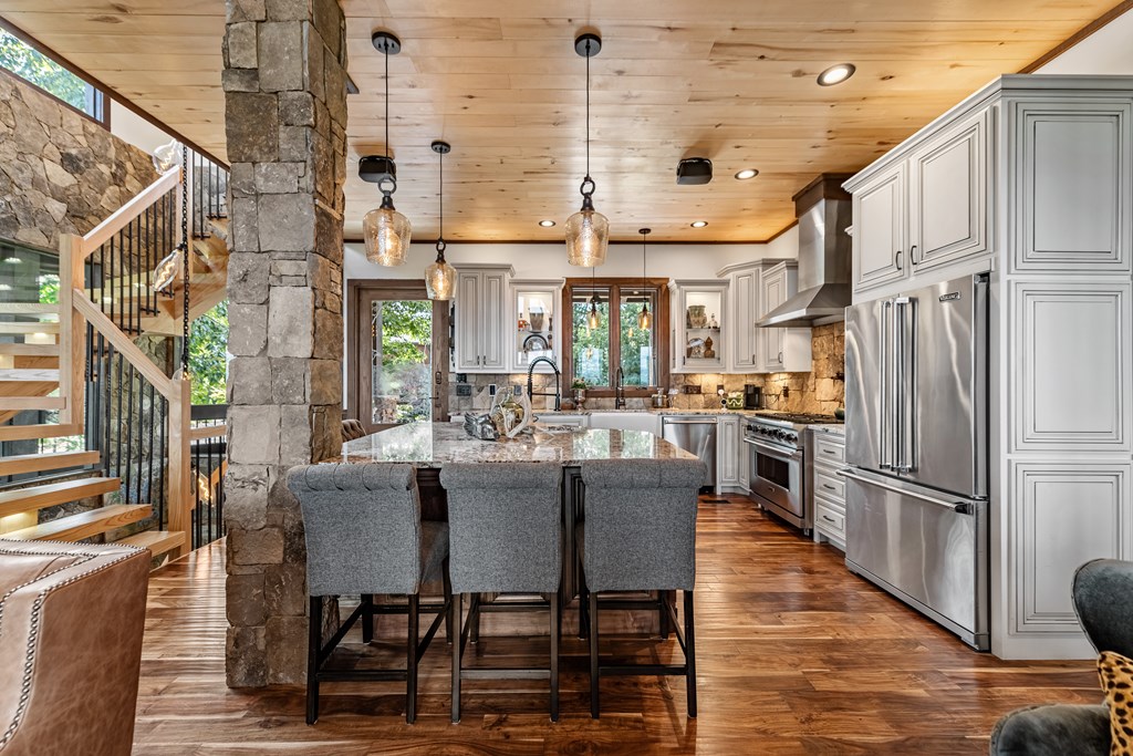 520 Overlook Drive Blue Ridge, GA 30513 - Photo 30 of 84 a kitchen with stainless steel appliances granite countertop a refrigerator and a stove top oven