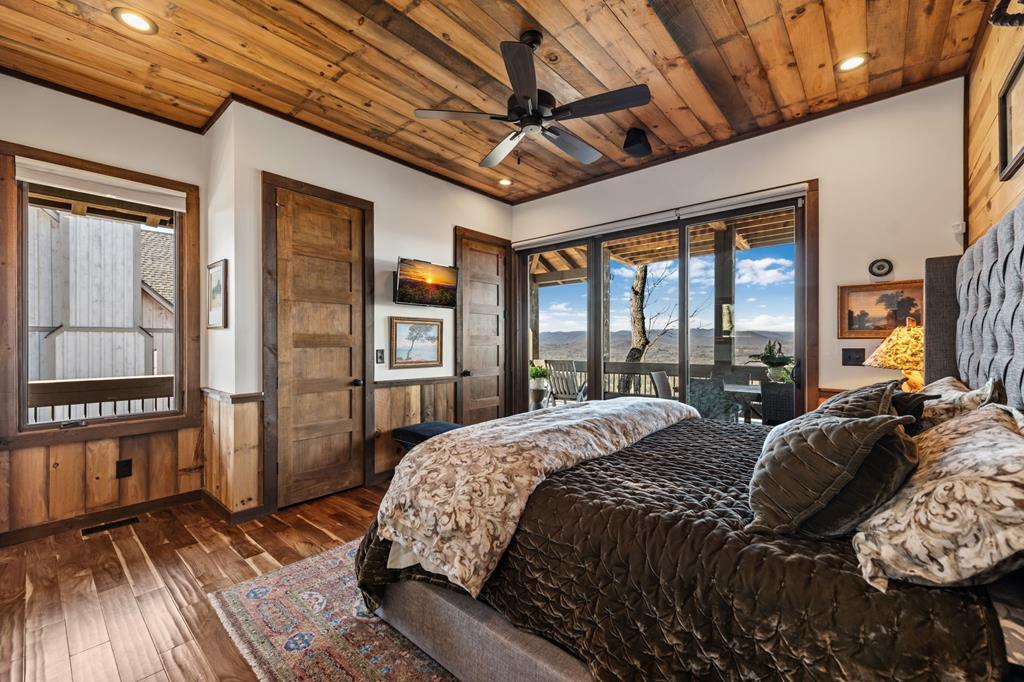 520 Overlook Drive Blue Ridge, GA 30513 - Photo 32 of 84 a bed sitting in a spacious bedroom next to a window