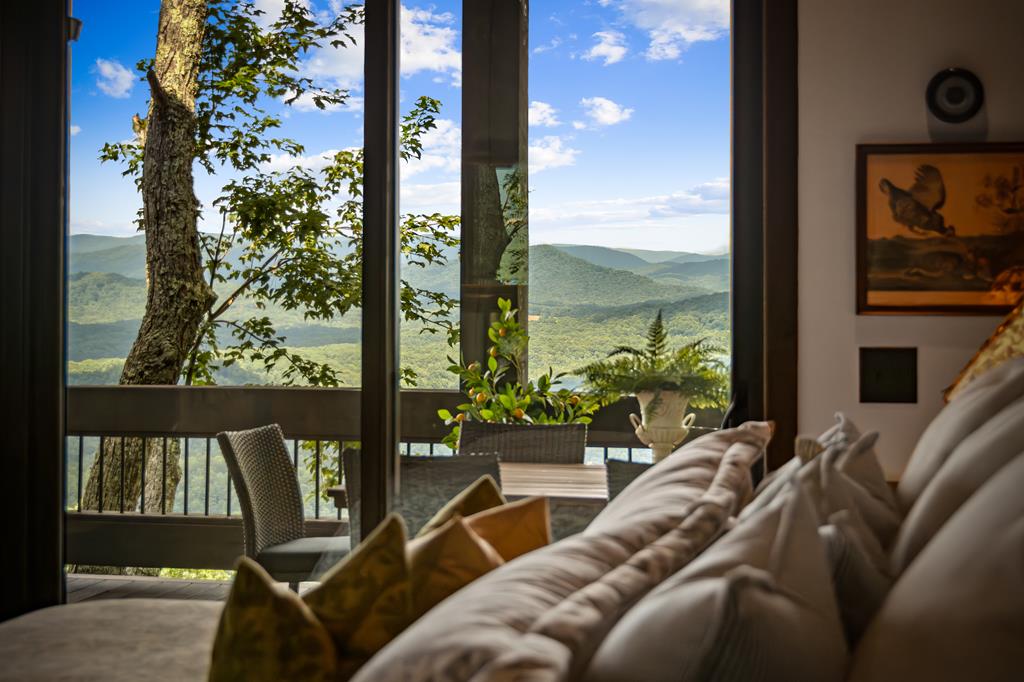 520 Overlook Drive Blue Ridge, GA 30513 - Photo 33 of 84 a living room with couch and a floor to ceiling window