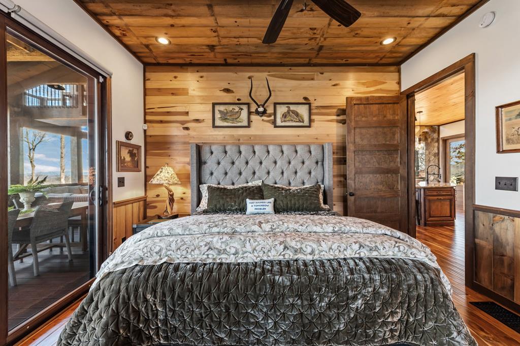 520 Overlook Drive Blue Ridge, GA 30513 - Photo 34 of 84 a bed sitting in a bedroom next to a window