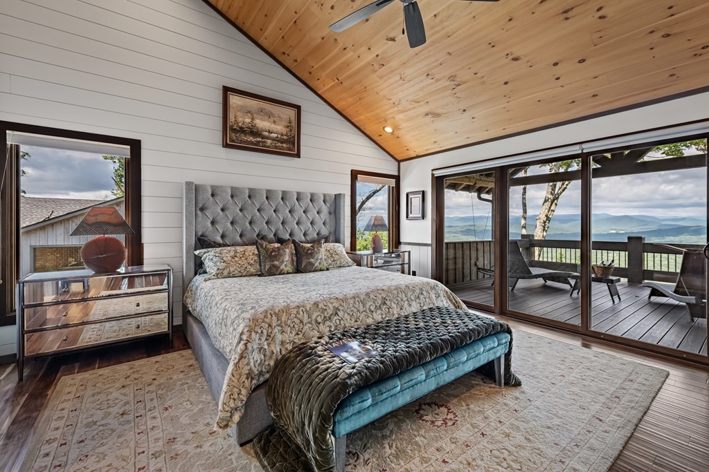 520 Overlook Drive Blue Ridge, GA 30513 - Photo 48 of 84 a bedroom with a bed couch and a dresser next to a window