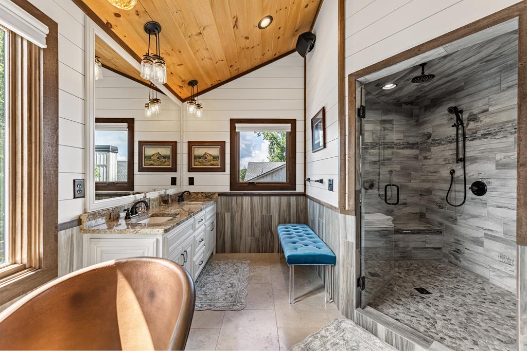 520 Overlook Drive Blue Ridge, GA 30513 - Photo 56 of 84 a bathroom with a granite countertop sink a mirror and shower