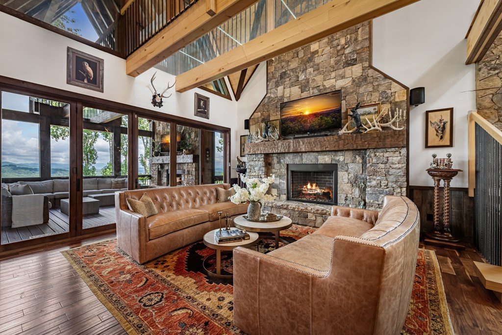 520 Overlook Drive Blue Ridge, GA 30513 - Photo 6 of 84 a living room with furniture a flat screen tv and a fireplace