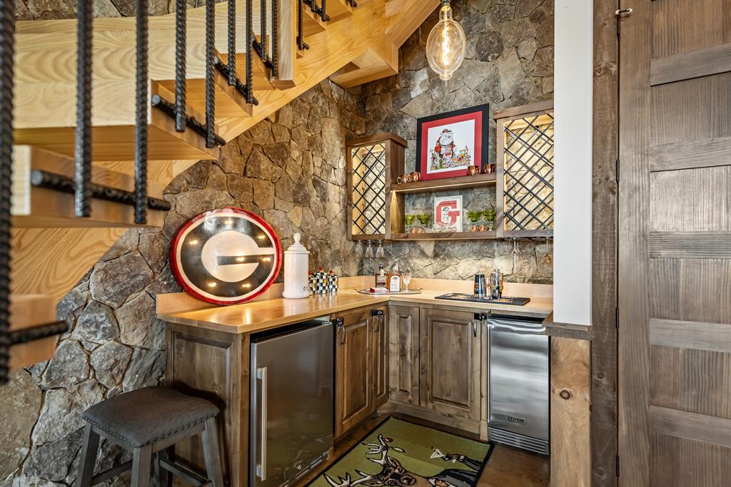 520 Overlook Drive Blue Ridge, GA 30513 - Photo 62 of 84 a bathroom with a sink a toilet and a shower curtain