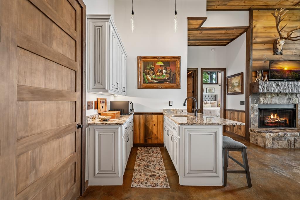 520 Overlook Drive Blue Ridge, GA 30513 - Photo 63 of 84 a kitchen with stainless steel appliances granite countertop a stove a sink and a refrigerator