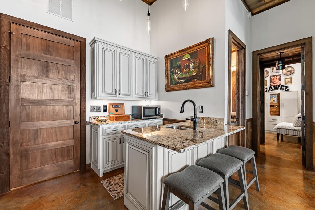 520 Overlook Drive Blue Ridge, GA 30513 - Photo 64 of 84 a kitchen with a stove a sink and a refrigerator