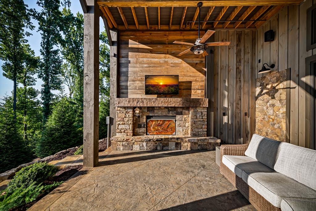 520 Overlook Drive Blue Ridge, GA 30513 - Photo 70 of 84 a living room with furniture a flat screen tv and a fireplace