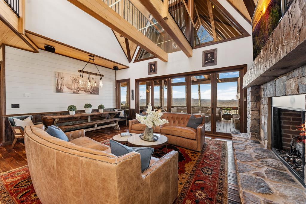 520 Overlook Drive Blue Ridge, GA 30513 - Photo 8 of 84 a living room with furniture a fireplace and a table