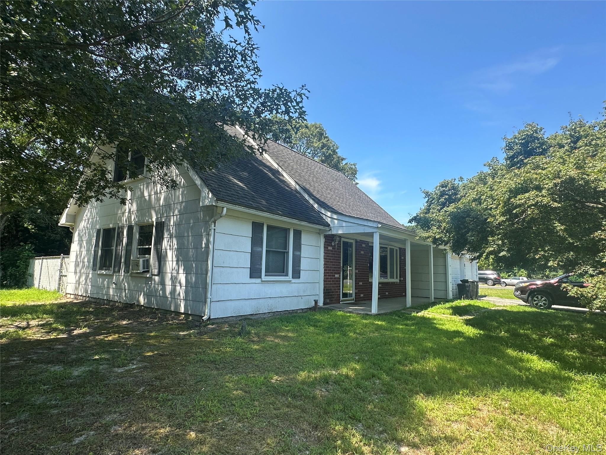 Front of House with a Covered Porch  and 2 Car Garage