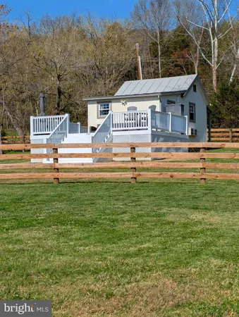a view of a house with a big yard