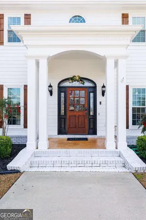 a living room with furniture flat screen tv and a fireplace