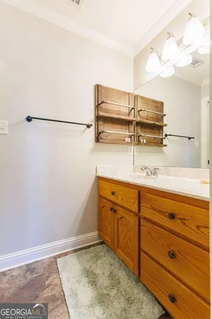 a view of a house with swimming pool and sitting area