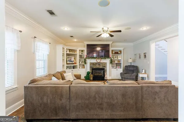 a kitchen with stainless steel appliances granite countertop a sink and refrigerator