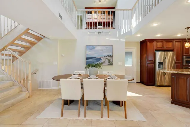 a view of a dining room with furniture and window