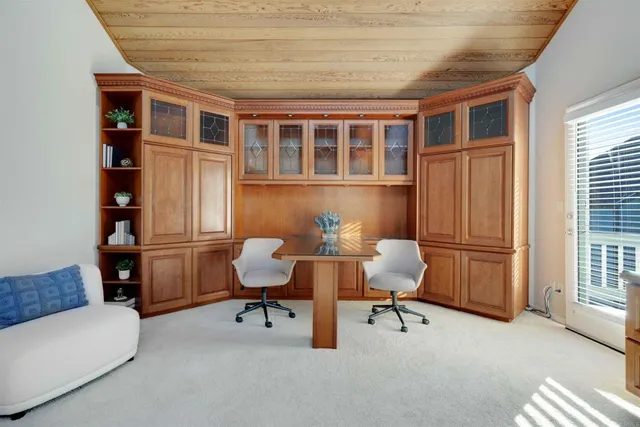 a view of a terrace with couches and sky view