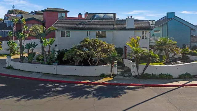 a view of a house with swimming pool and porch with furniture