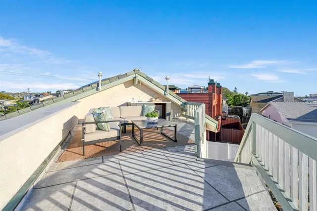a view of a balcony with chairs