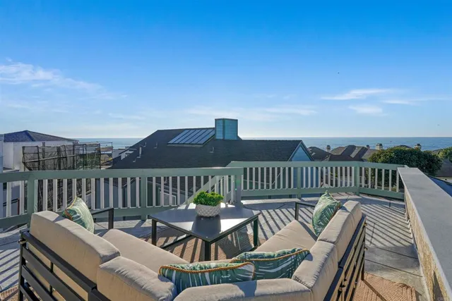 a view of a balcony with chairs