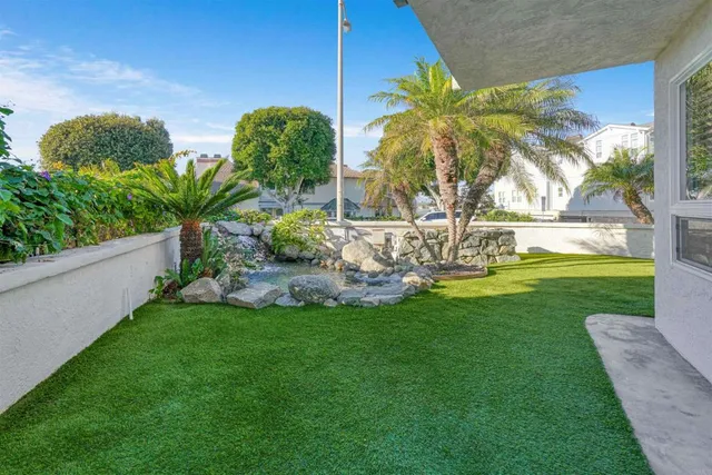 a view of a house with a small yard