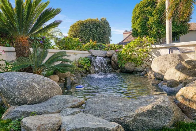 a view of a chairs and table in the patio