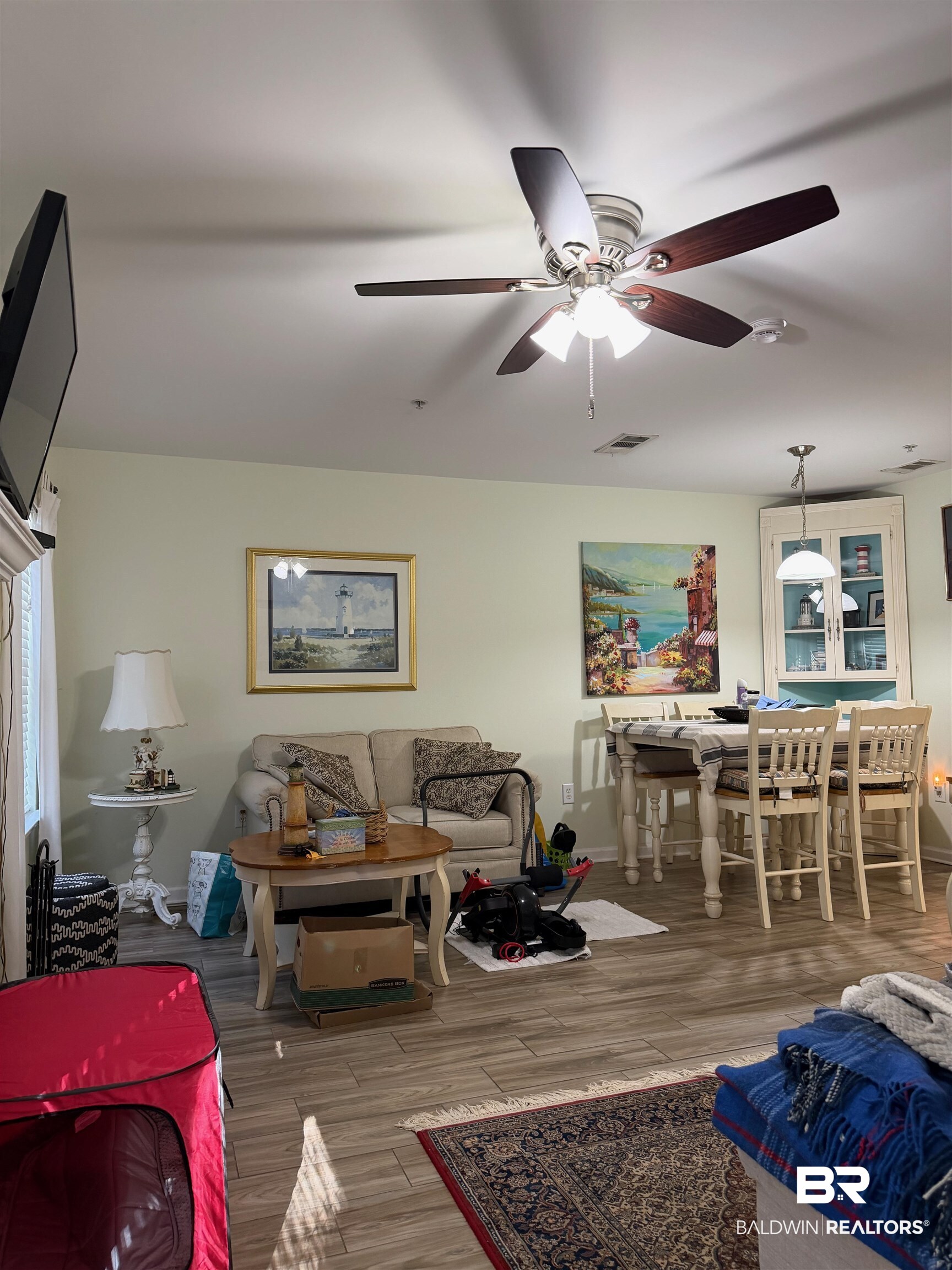 1517 Regency Road, Unit 71 Gulf Shores, AL 36542 - Photo 9 of 26 Living room featuring wood finished floors and ceiling fan