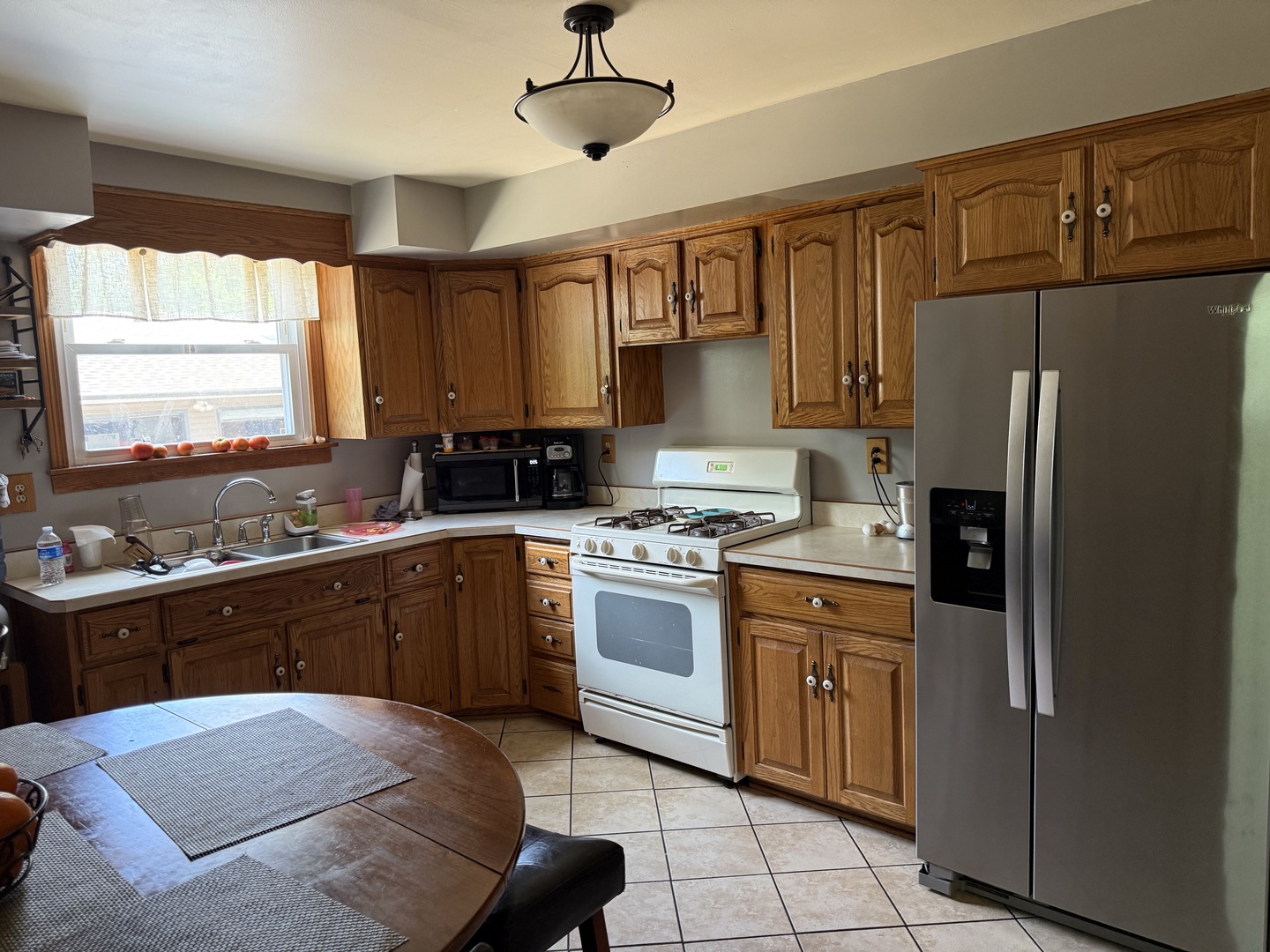 218 West 1st Street Spring Valley, IL 61362 - Photo 19 of 30 a kitchen with stainless steel appliances granite countertop a refrigerator a sink dishwasher a stove and white countertops with wooden floor