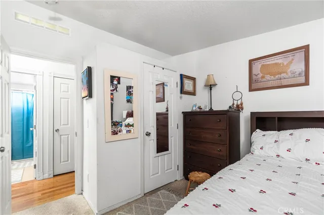 a bedroom with a bed and a dresser