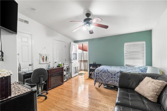 a bathroom with a granite countertop sink a toilet and a large mirror