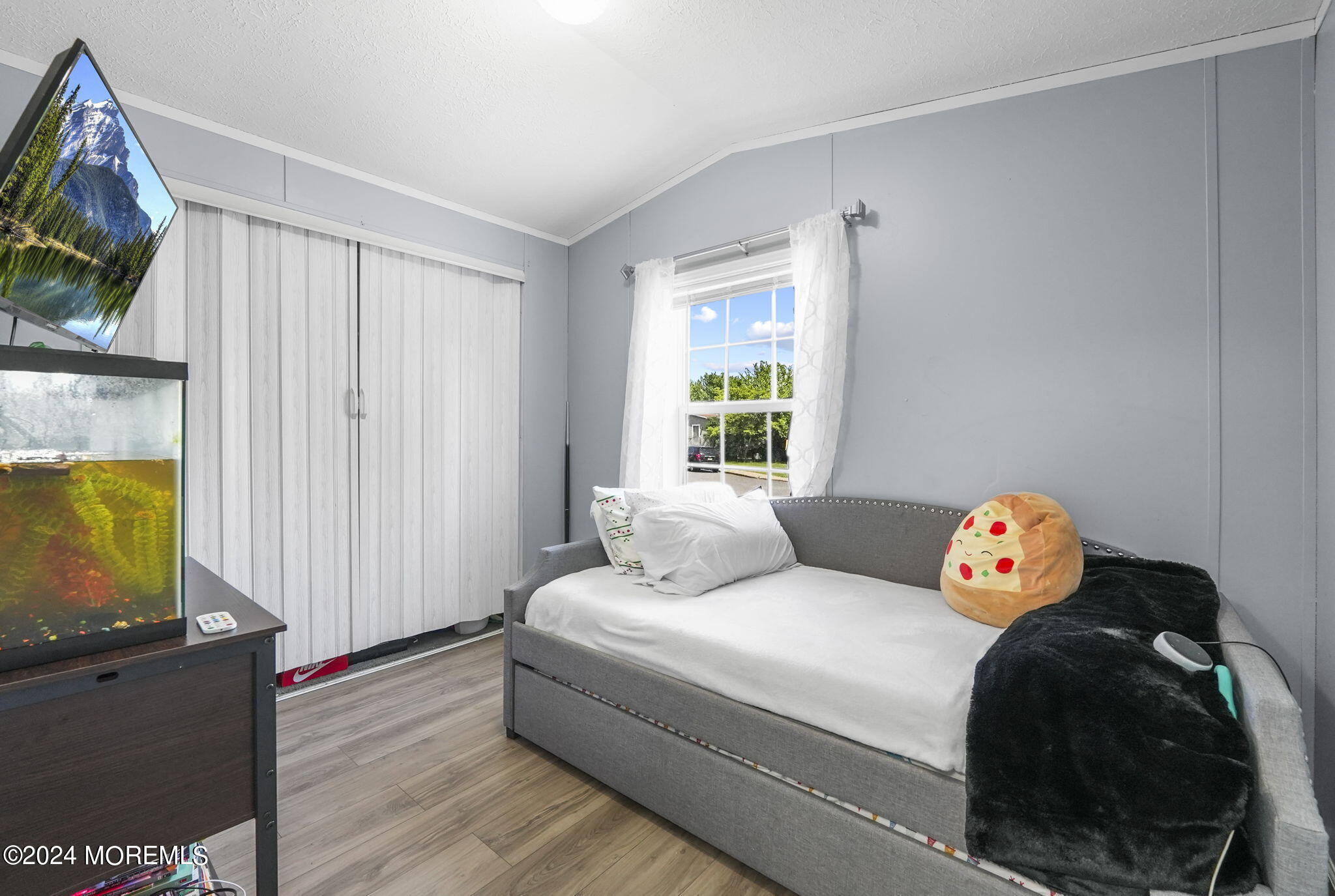 813 North Street Jackson, NJ 08527 - Photo 12 of 19 a bedroom with a bed and a flat screen tv