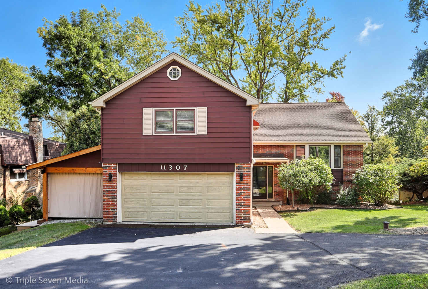11307 German Church Road Willow Springs, IL 60480 - Photo 2 of 49 a front view of a house with a yard and garage