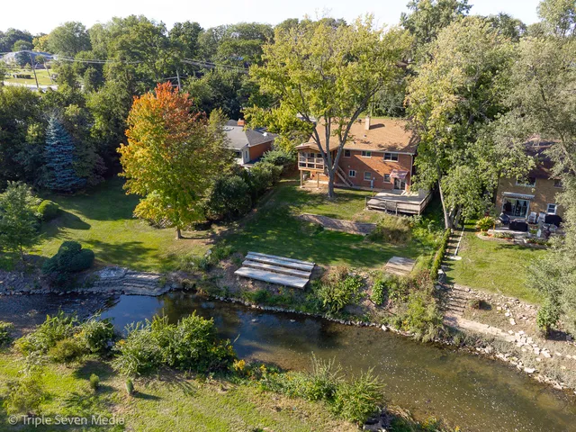 an aerial view of residential houses with outdoor space
