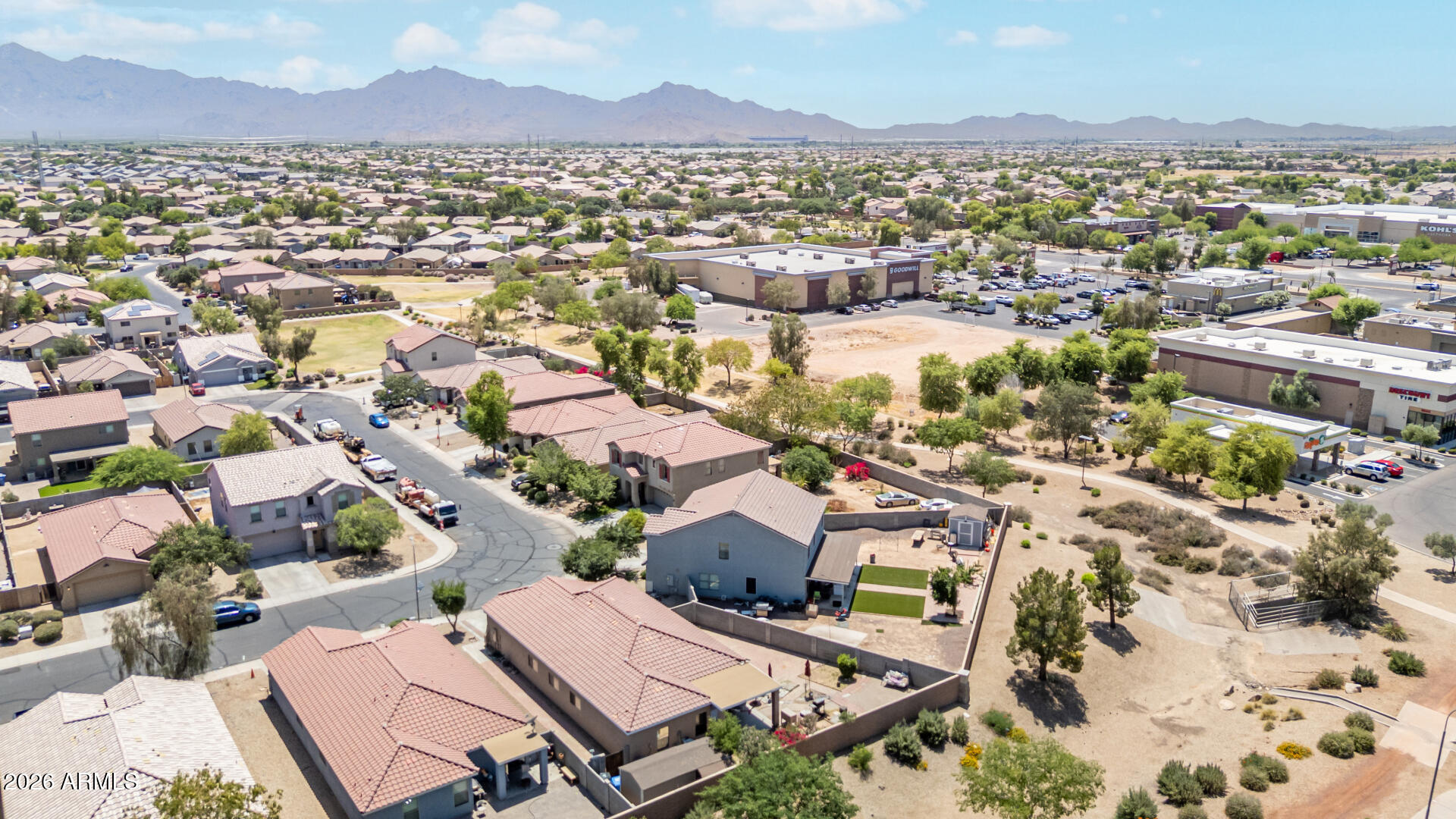 9730 West Payson Road Tolleson, AZ 85353 - Photo 44 of 57 an aerial view of residential houses with outdoor space