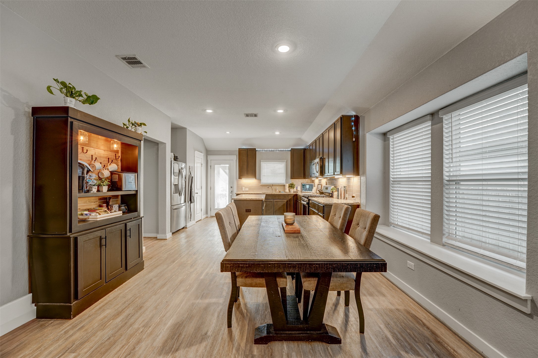 5806 Aviano Road Round Rock, TX 78665 - Photo 19 of 29 An inviting open-concept dining area flows seamlessly into a well-appointed kitchen.