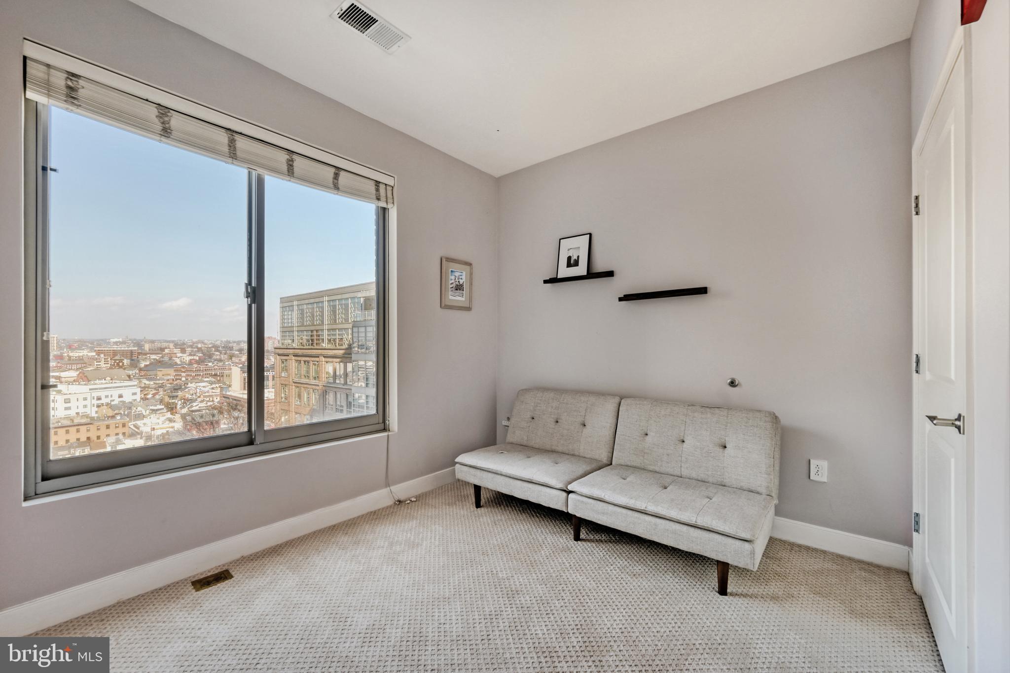 675 President Street, Unit 1406 Baltimore, MD 21202 - Photo 19 of 46 a living room with furniture and a window