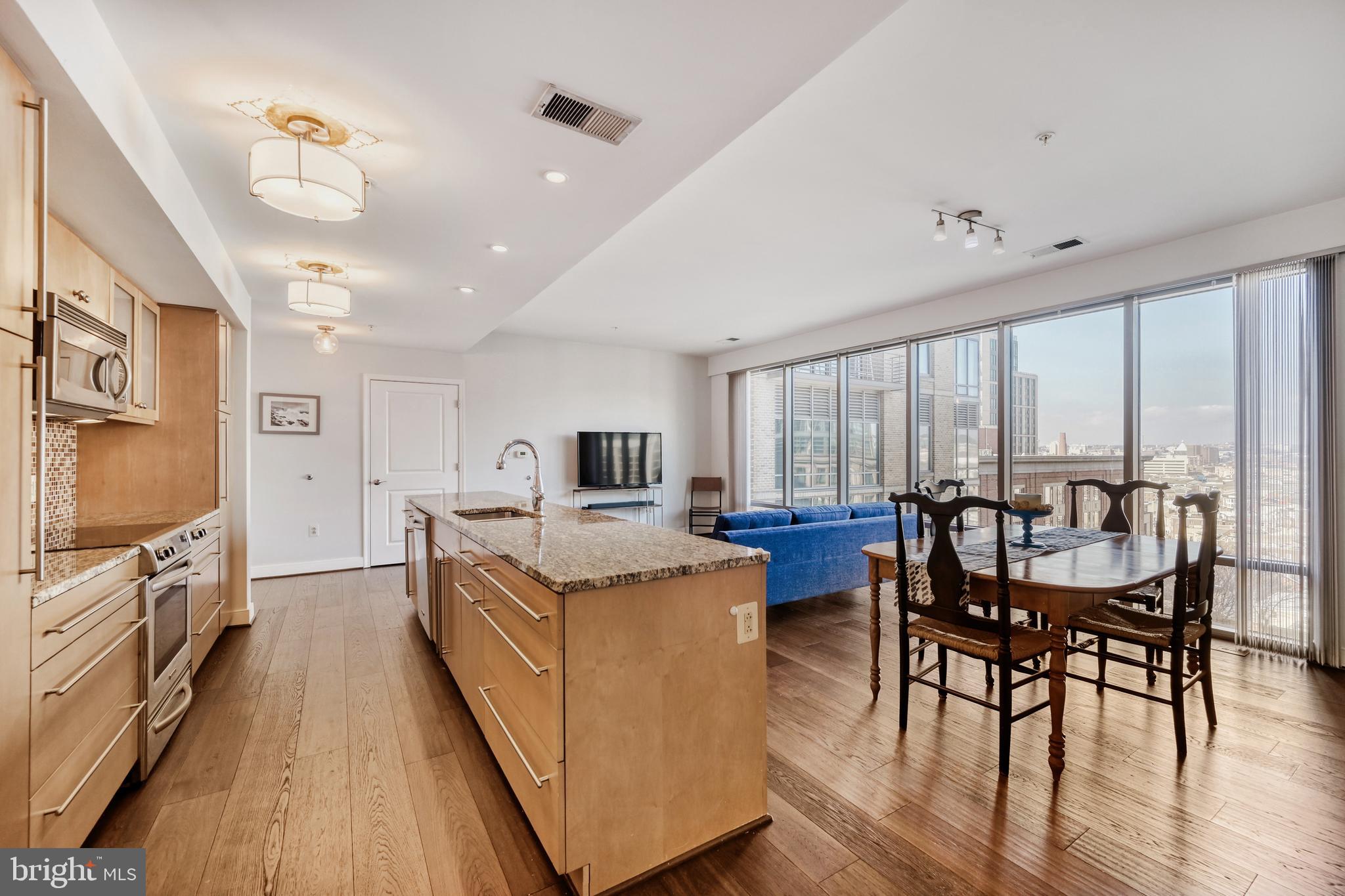 675 President Street, Unit 1406 Baltimore, MD 21202 - Photo 6 of 46 a kitchen with sink stove and refrigerator