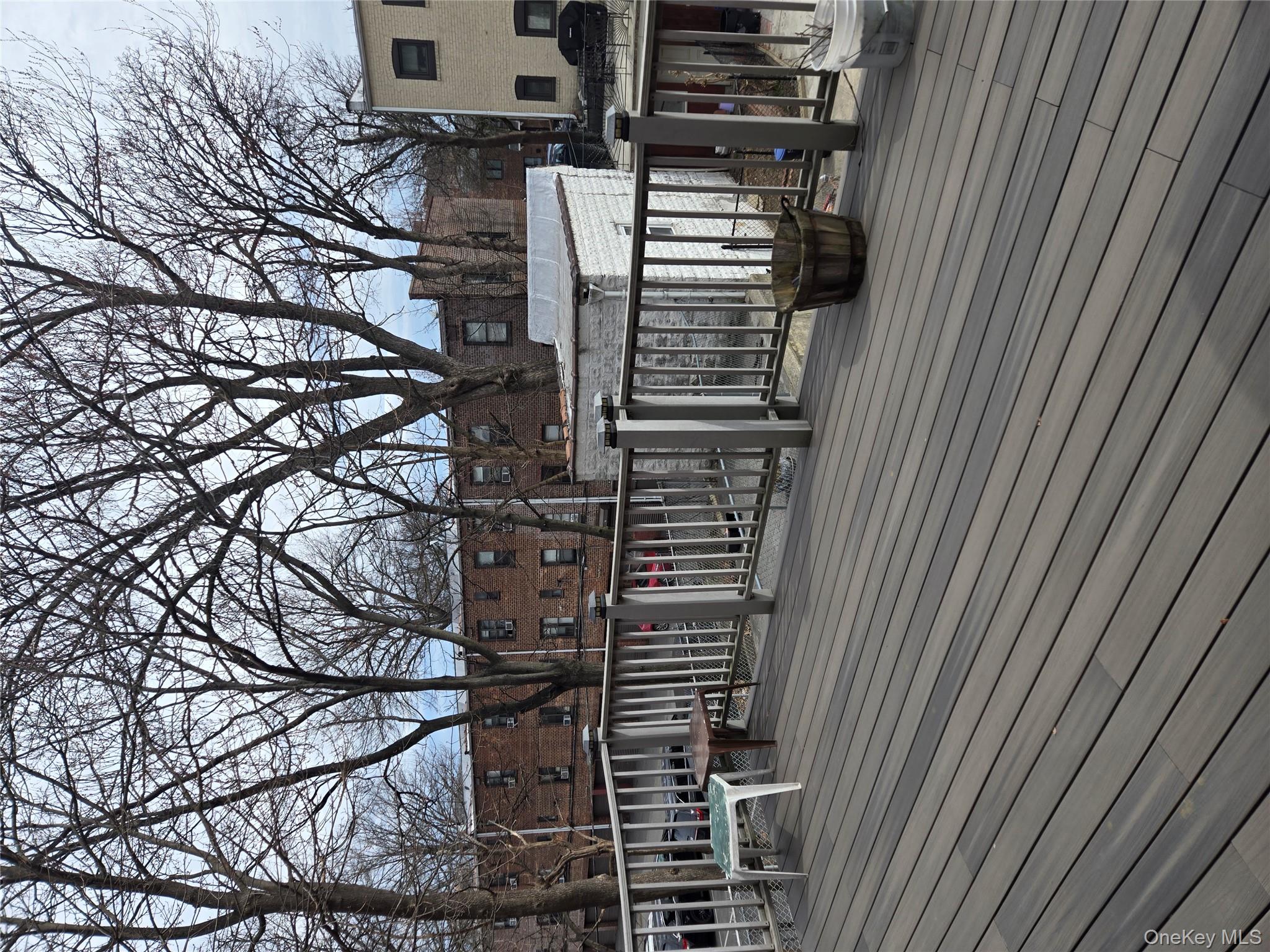 89-12 Rutledge Avenue Queens, NY 11385 - Photo 13 of 13 a view of a deck with mountain view and wooden floor