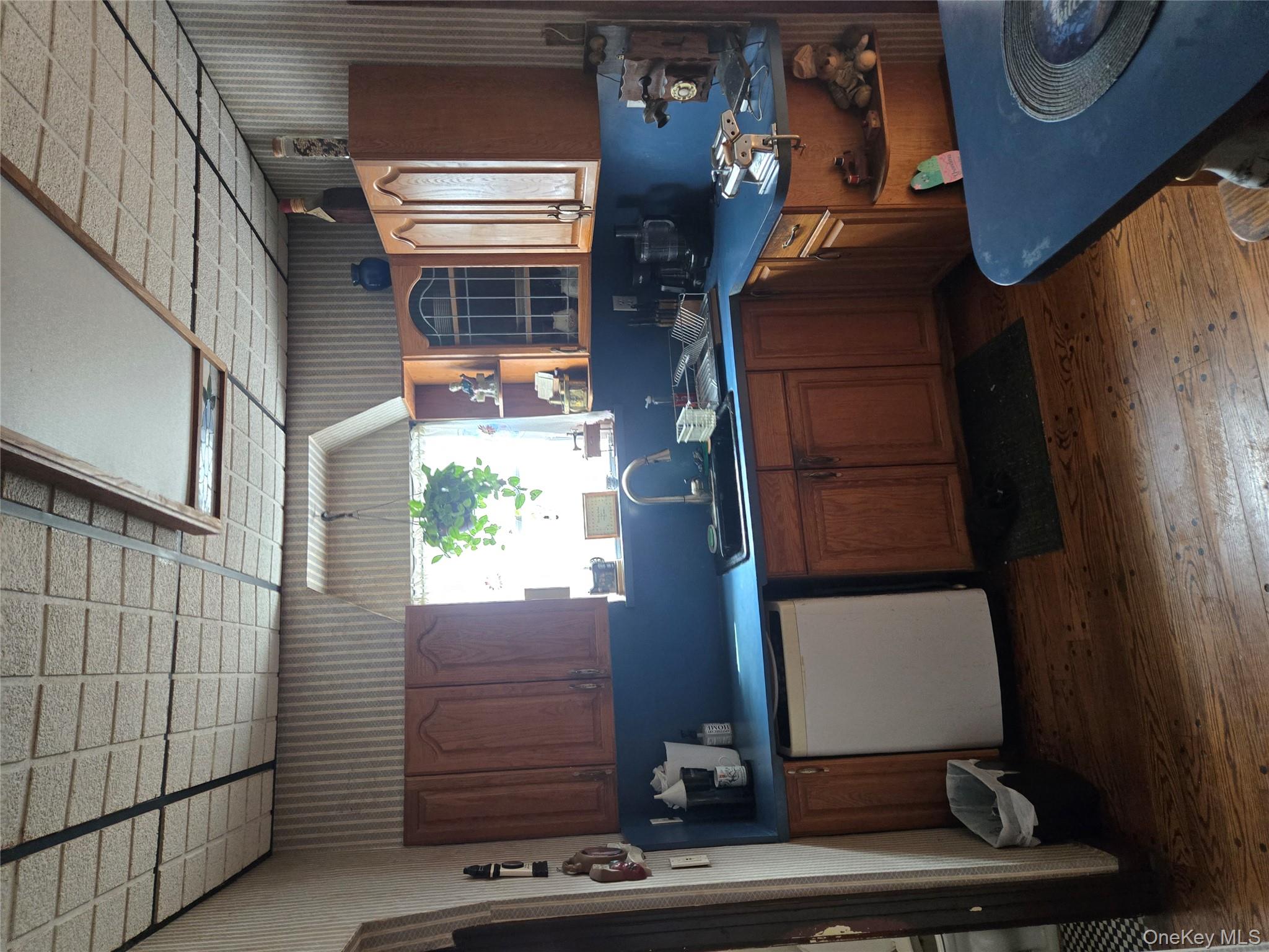 89-12 Rutledge Avenue Queens, NY 11385 - Photo 2 of 13 a kitchen with granite countertop a sink a counter space appliances and cabinets