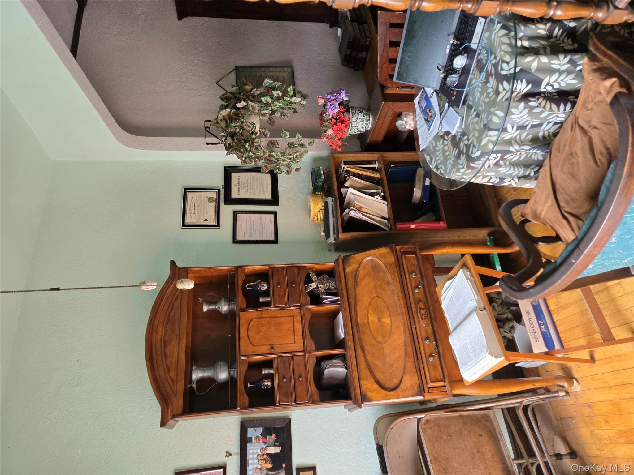 89-12 Rutledge Avenue Queens, NY 11385 - Photo 4 of 13 a room with furniture and flowers