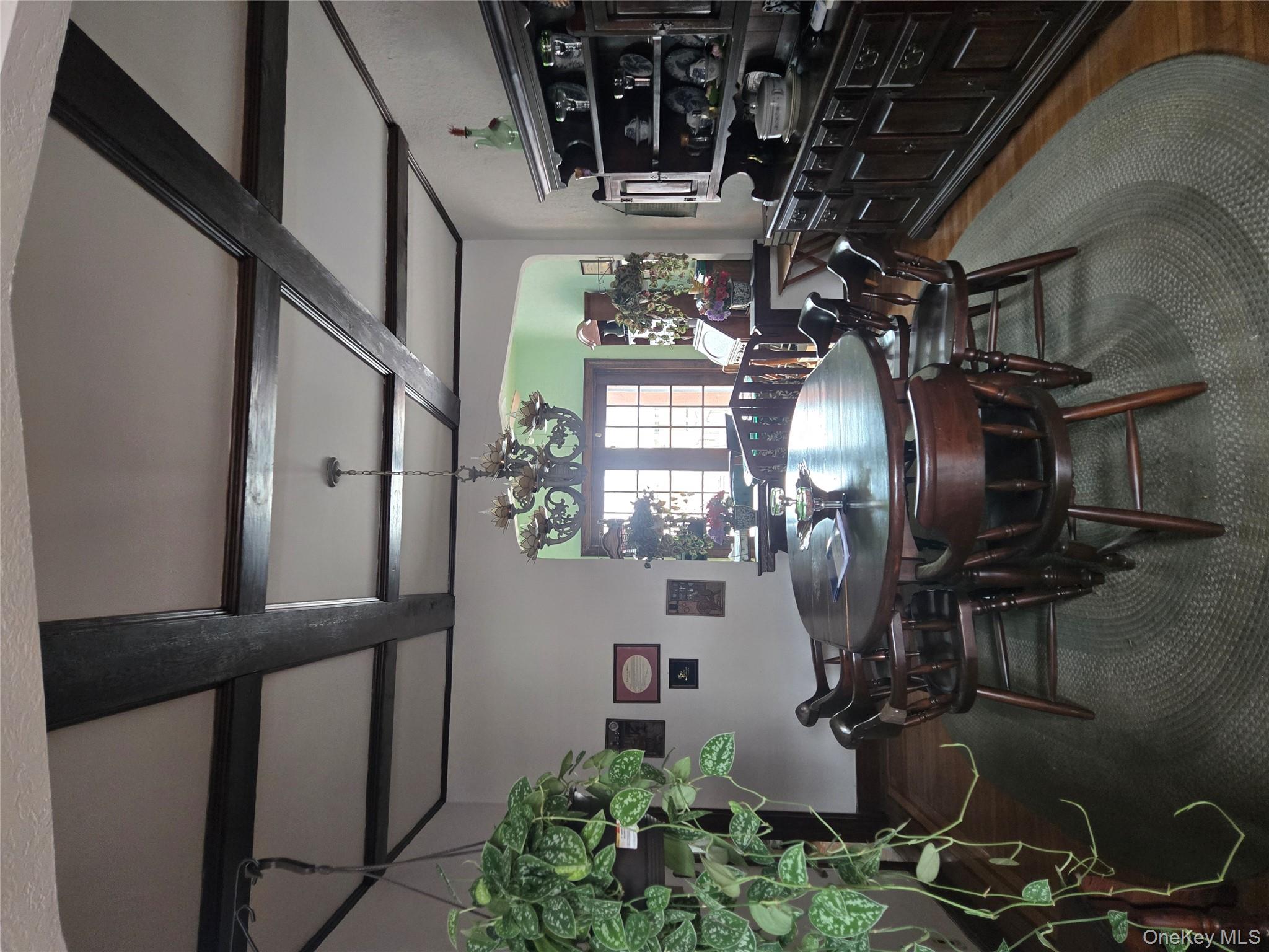 89-12 Rutledge Avenue Queens, NY 11385 - Photo 5 of 13 a view of a dining room with furniture