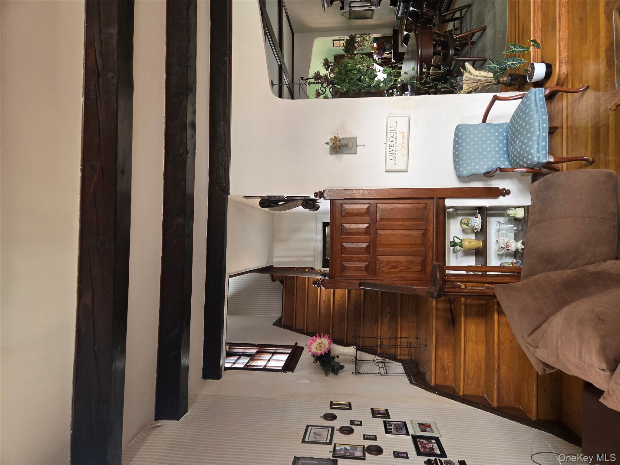 89-12 Rutledge Avenue Queens, NY 11385 - Photo 8 of 13 a living room with furniture and wooden floor