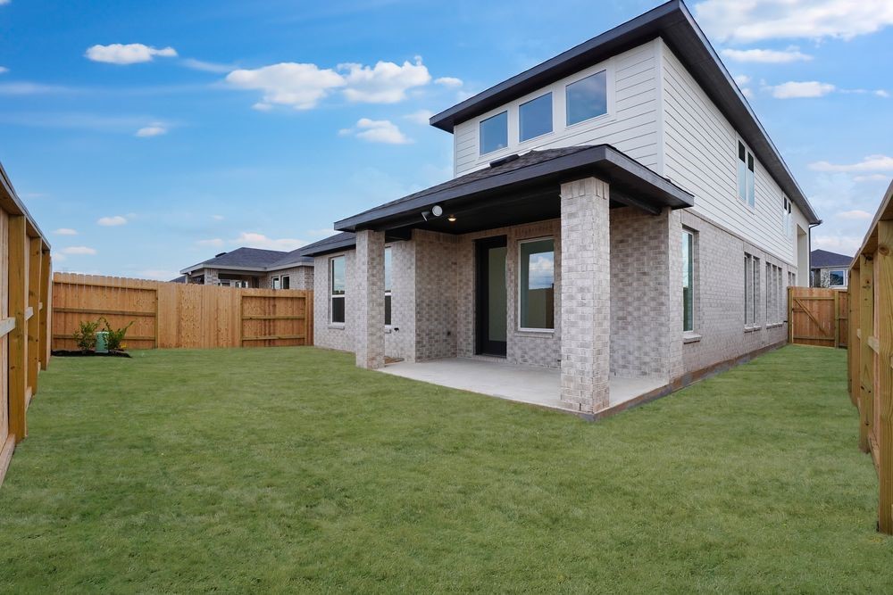 22130 Rangemore Drive Cypress, TX 77433 - Photo 23 of 36 a front view of a house with a garden and yard