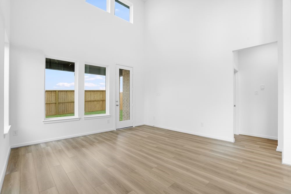22130 Rangemore Drive Cypress, TX 77433 - Photo 6 of 36 an empty room with wooden floor and windows