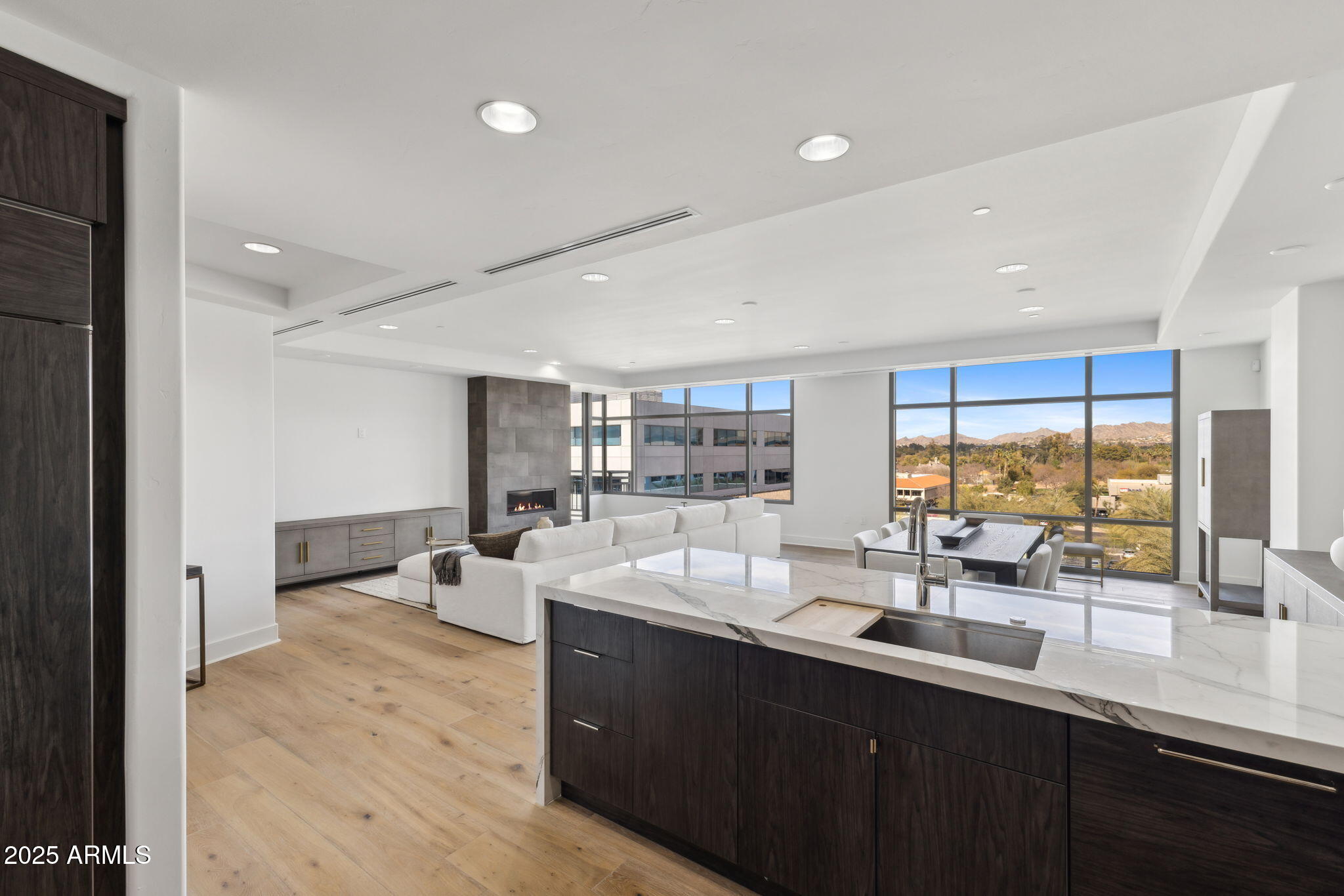 2211 East Camelback Road, Unit 601 Phoenix, AZ 85016 - Photo 11 of 61 a kitchen with sink refrigerator and large window
