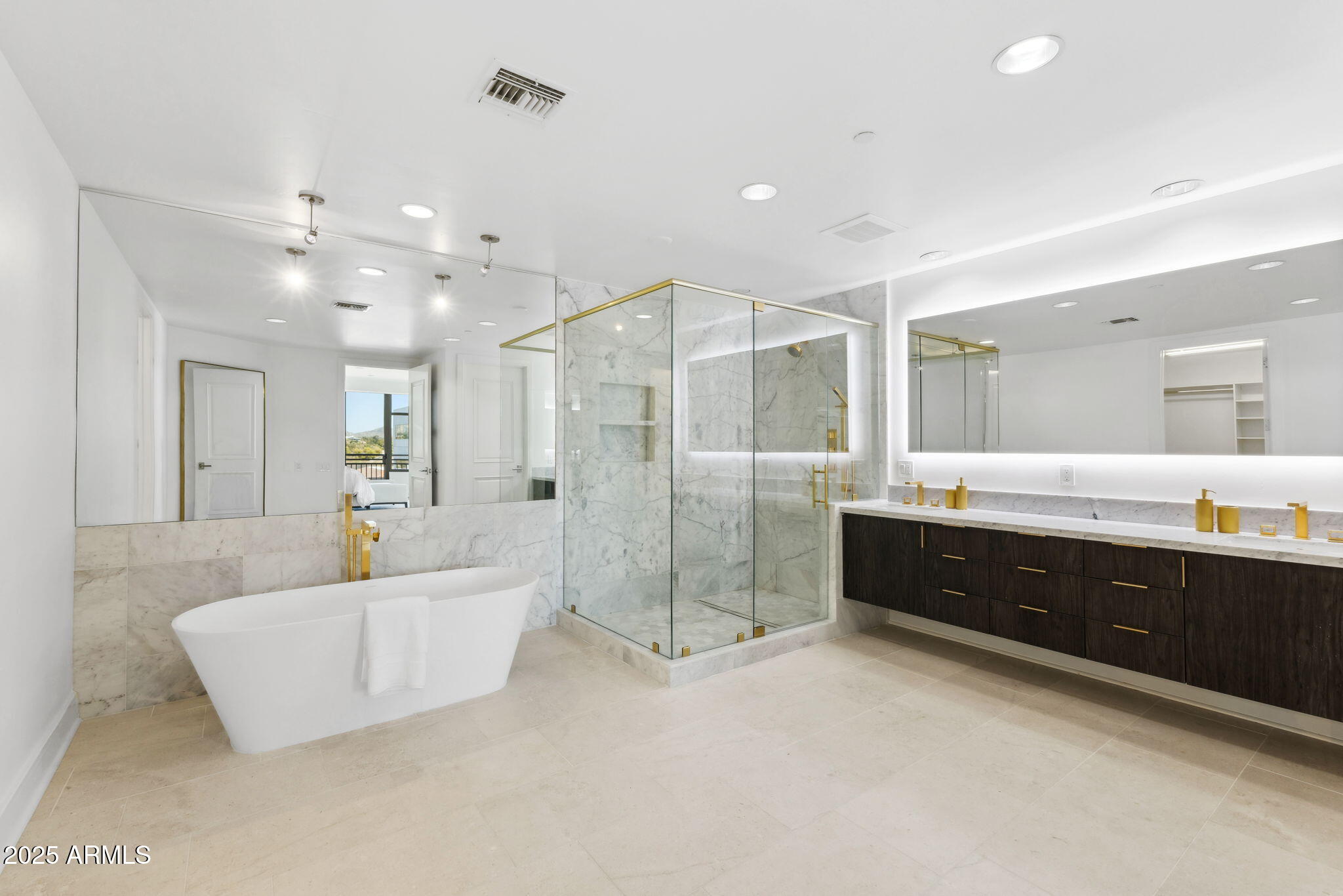2211 East Camelback Road, Unit 601 Phoenix, AZ 85016 - Photo 22 of 61 a spacious bathroom with a tub sink shower and mirror