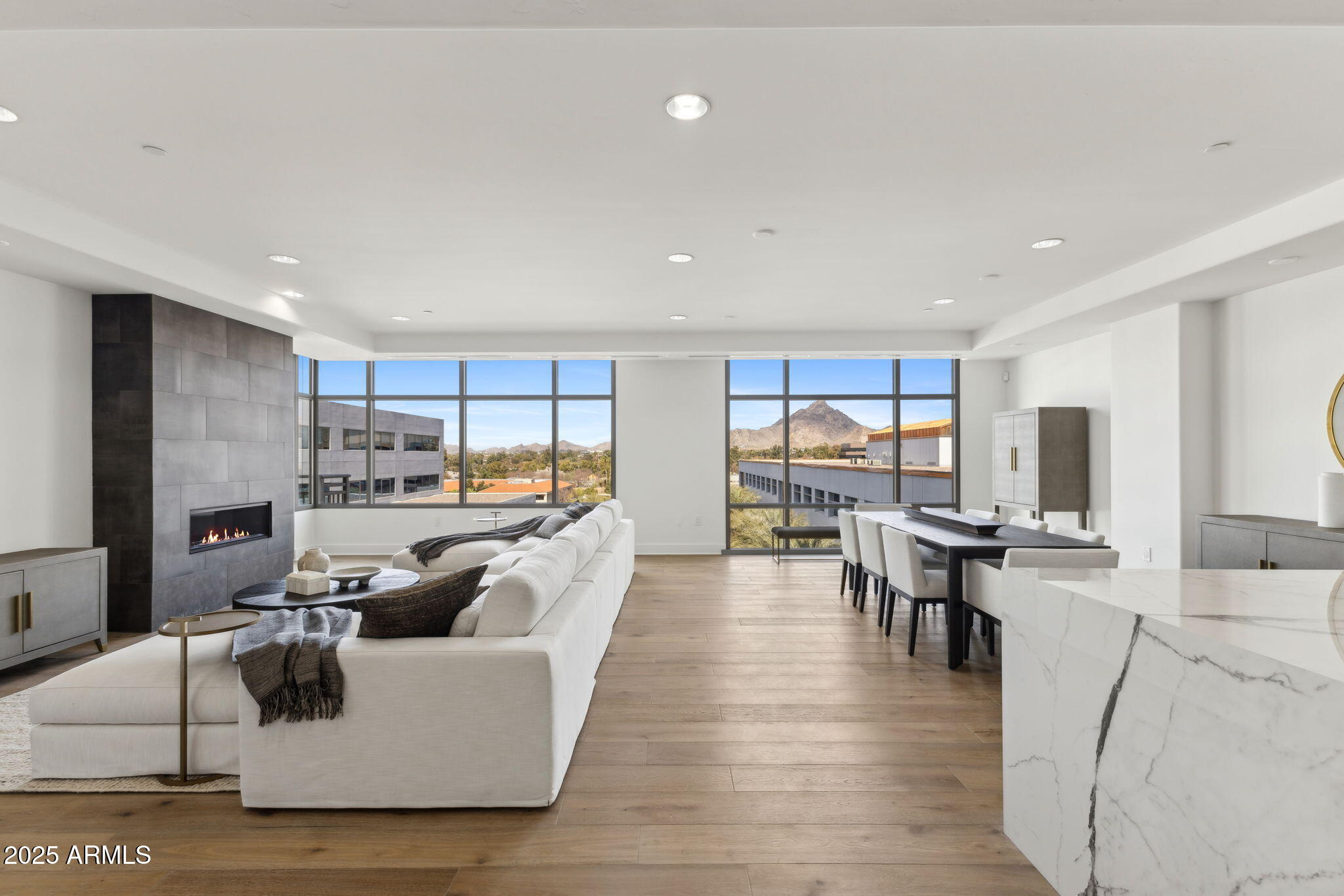 2211 East Camelback Road, Unit 601 Phoenix, AZ 85016 - Photo 3 of 61 a living room with fireplace furniture and a large window