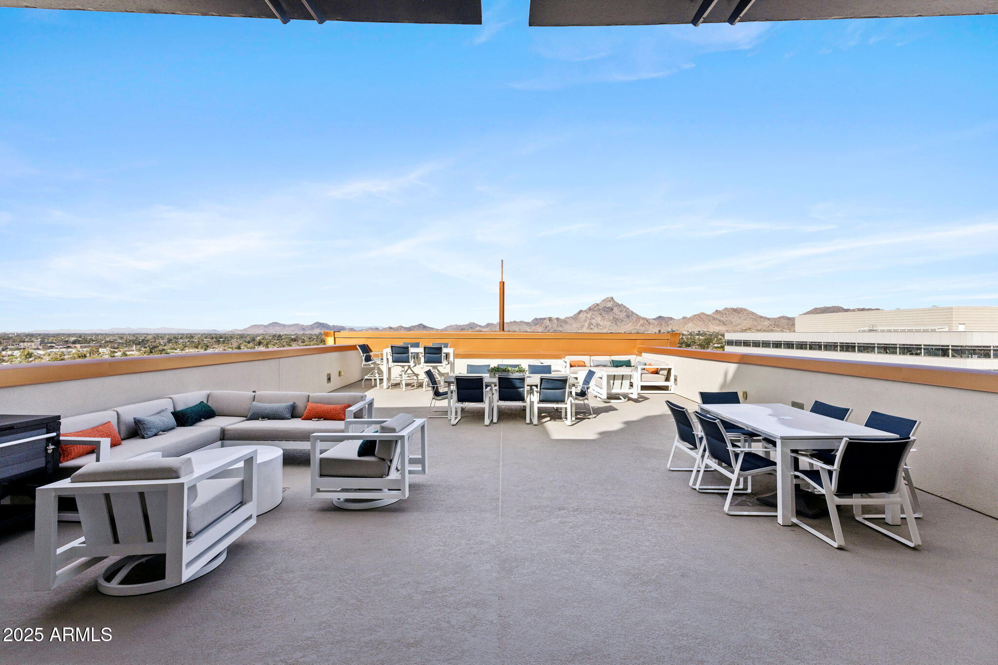 2211 East Camelback Road, Unit 601 Phoenix, AZ 85016 - Photo 33 of 61 a view of a terrace with outdoor seating and city view